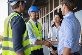 Maritech project manager shaking hands with a general contractor on a commercial jobsite